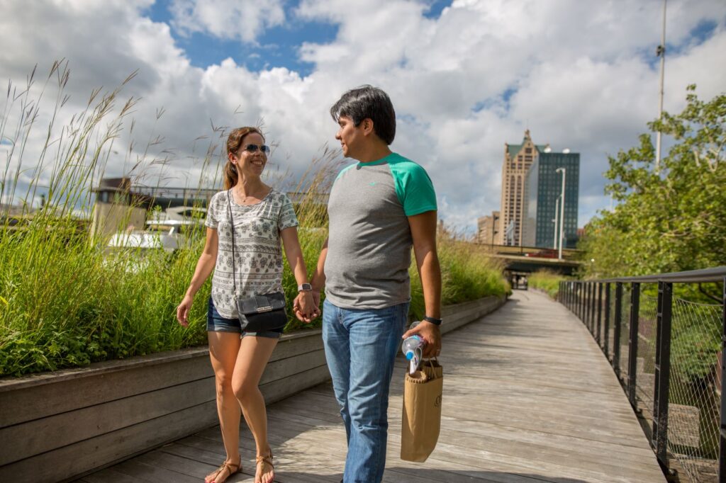 Couple walking along the river in Milwaukee